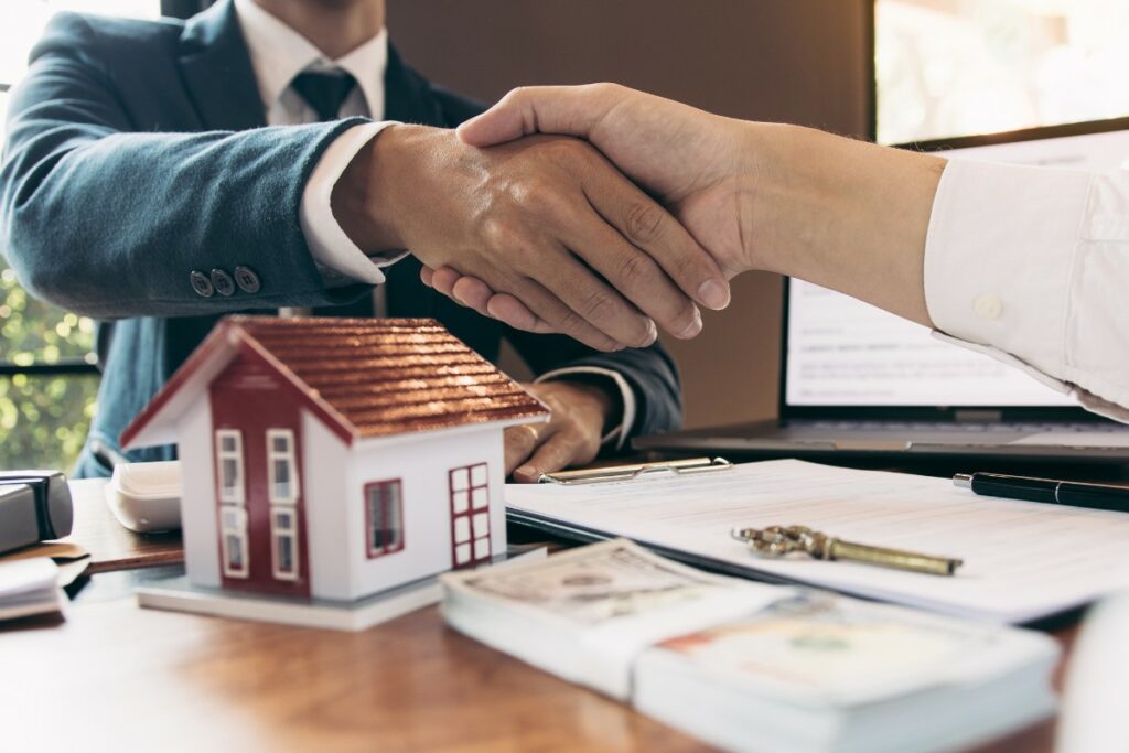 Handshake representing refinancing from conventional to VA loan